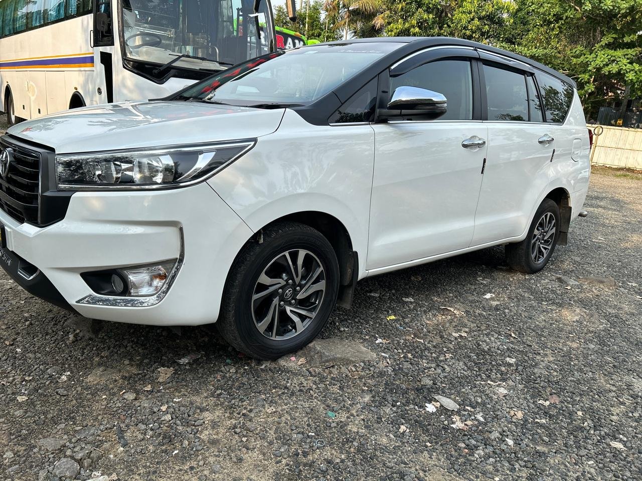 Toyota Innova Crysta white outstation taxi side view